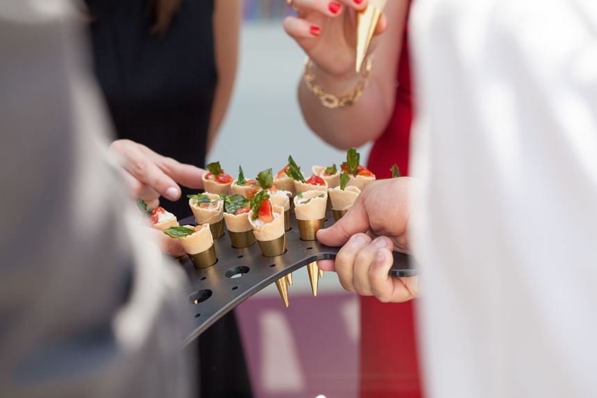 Serving appetizers to the guests at Momentus Hotel Alexandra 
