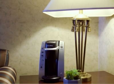 lamp shed & keurig machine on table at The Inn of Waterloo