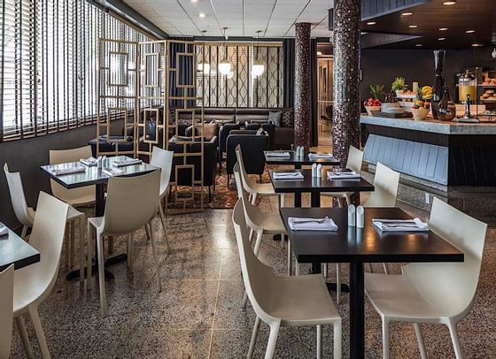 Dining area in Lapidus Restaurant at Capitol Skyline Hotel