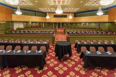 Theater room with rows of conference tables.