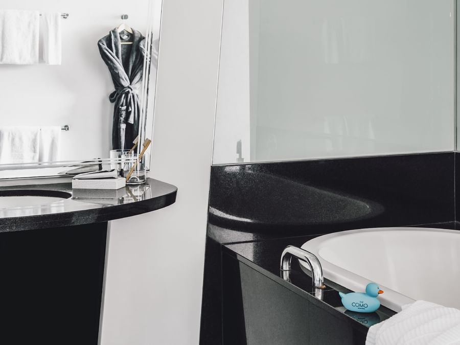 Bathroom vanity & tub in 2 Bed Superior Room at Como Melbourne
