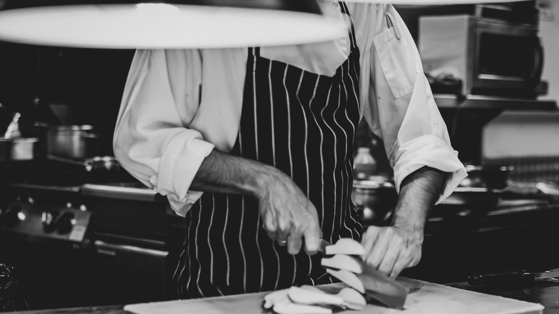 Close up on chefs preparing meal at Novotel Melbourne on Collin