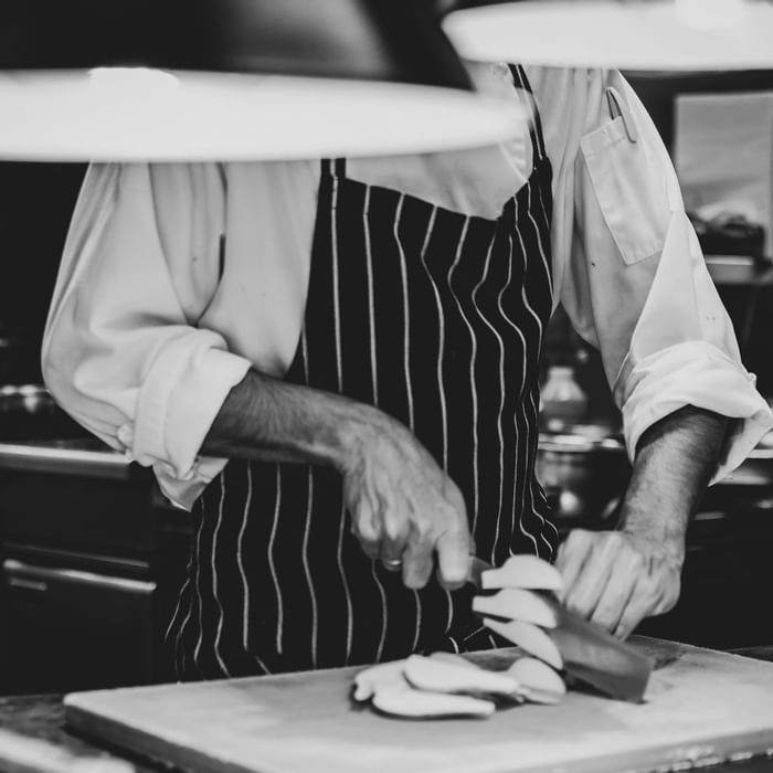 Close up on chefs preparing meal at Novotel Melbourne on Collin