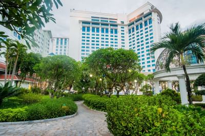 Garden area with trees and bushes at Hanoi Daewoo Hotel