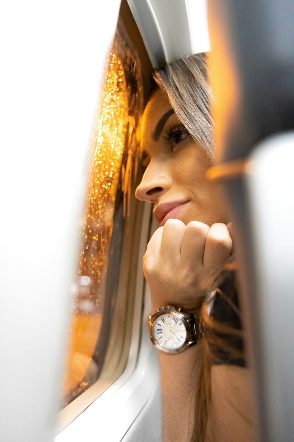 a girl closer to a window