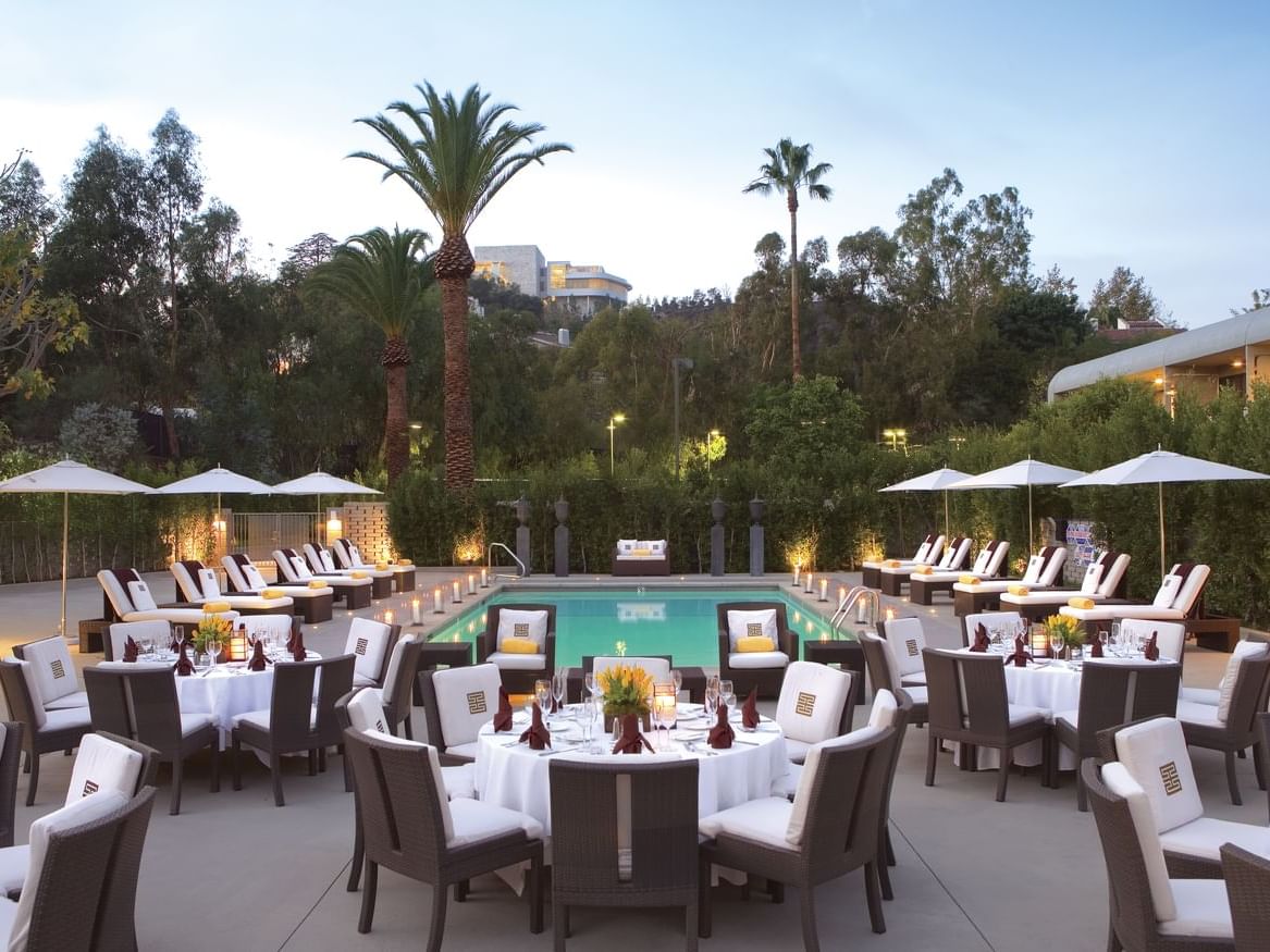 Table setting near pool for events at Luxe Sunset Boulevard