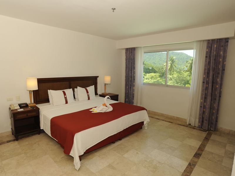 Interior of Superior Room with King bed at Gamma Hotels