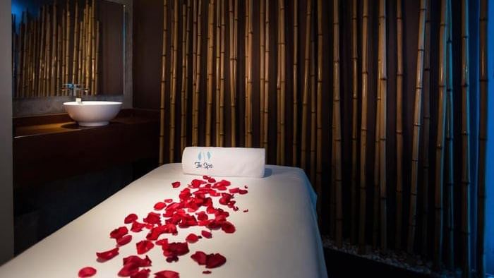 A spa bed decorated with rose petals at Fiesta Americana Mérida