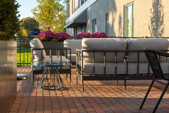 couches and chairs on an outdoor deck