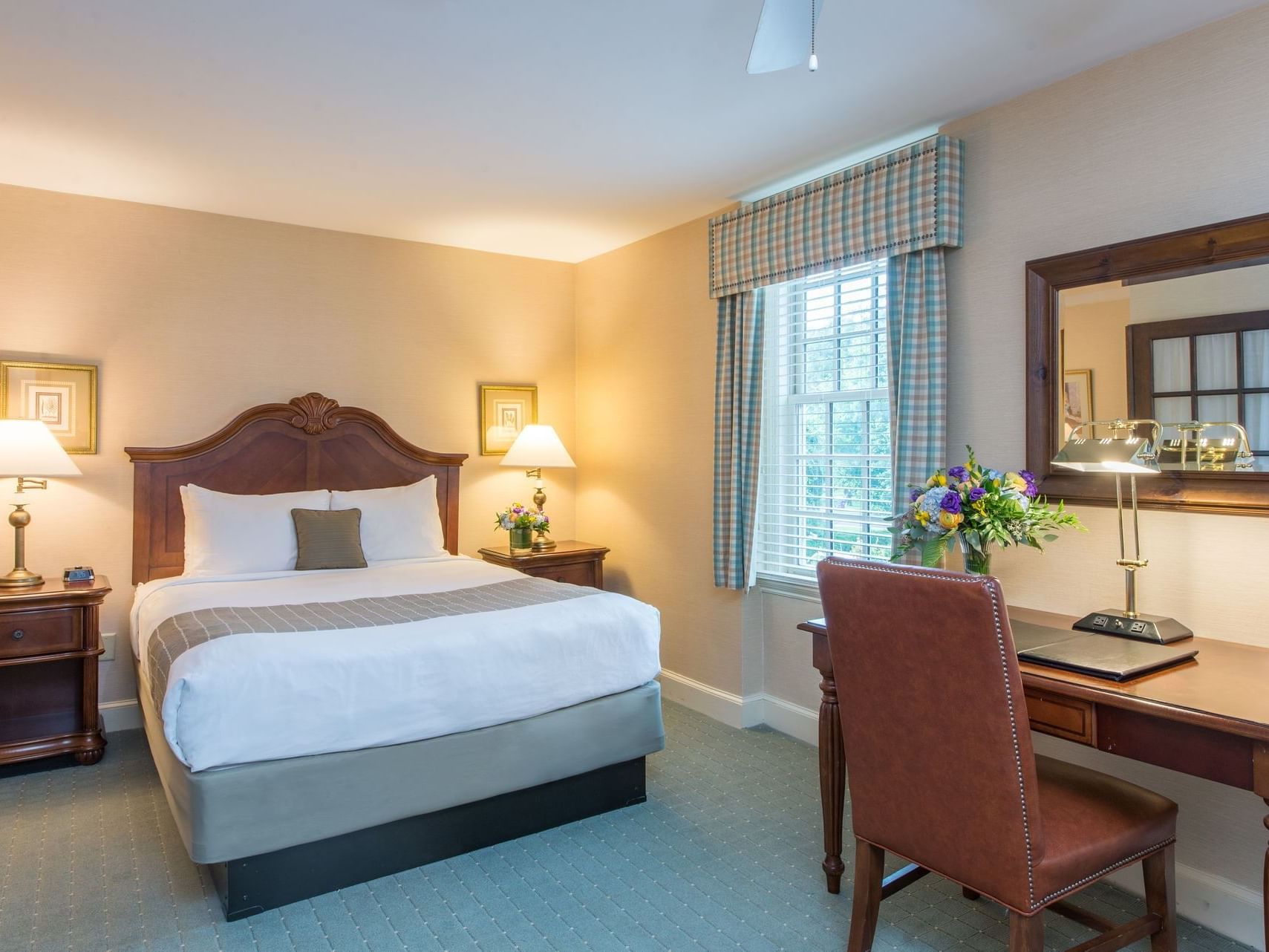 King bed & study table in Queen Suite at The Exeter Inn