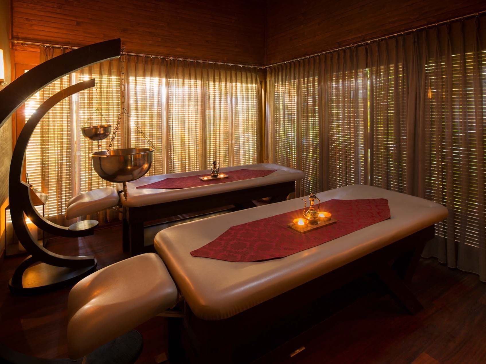 Two massage beds with spa amenities in BeFine Spa at Titanic Deluxe Golf Belek