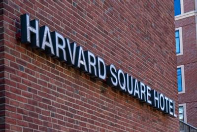 sign that says harvard square hotel