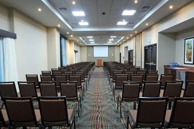 Rooftop pool with lounge chairs, umbrellas, and cityscape at MARINN PLACE Financial District