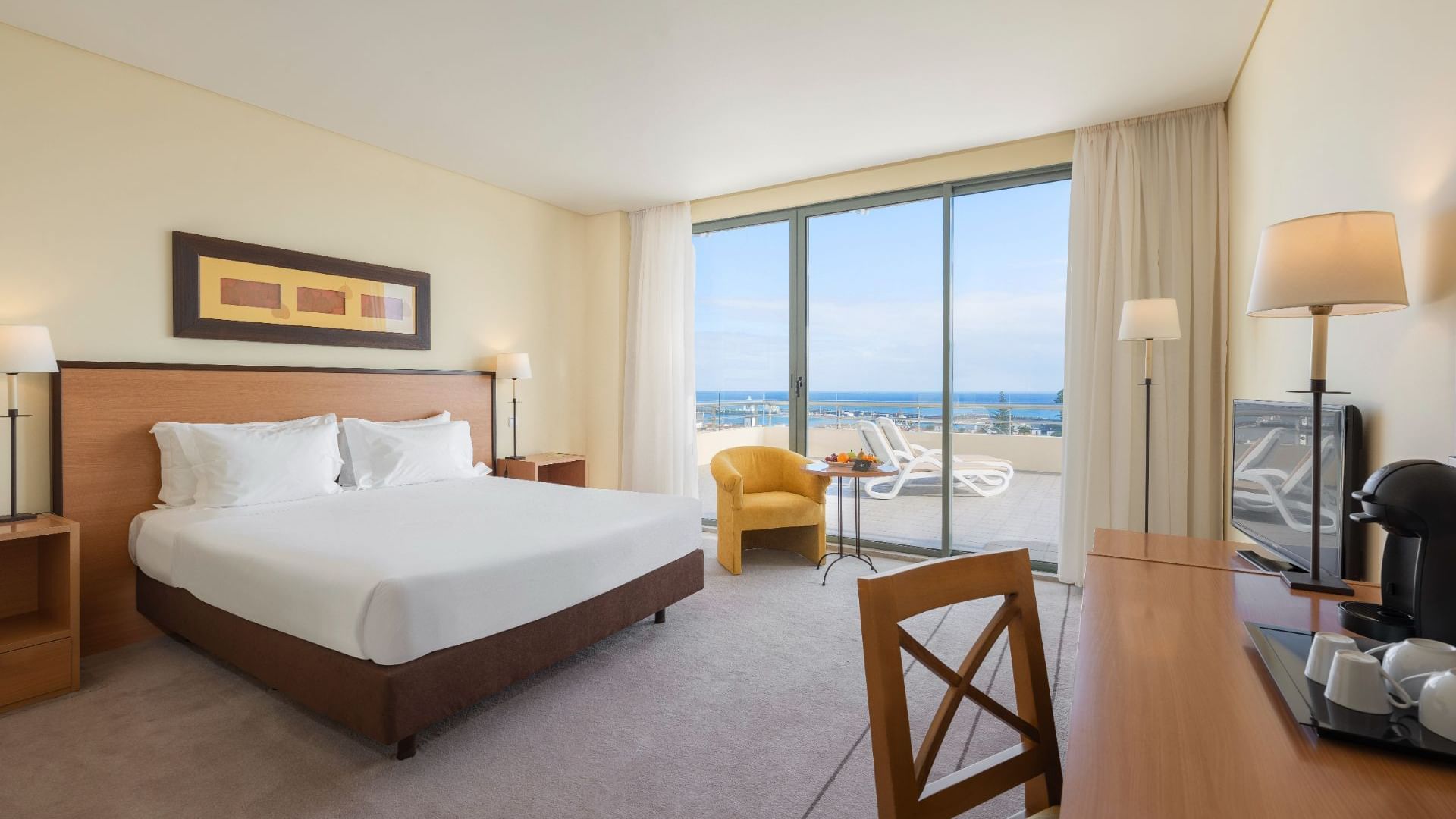 Bed in Standard Plus Room with the sea view at Bensaude Hotels
