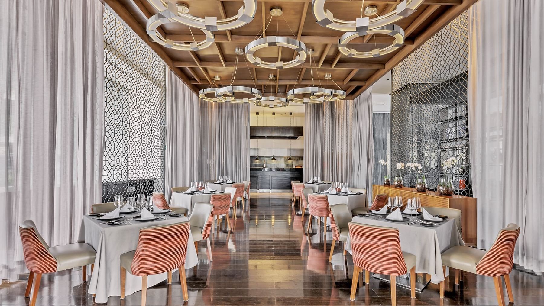 Interior of a restaurant dining hall at Grand Fiesta Americana