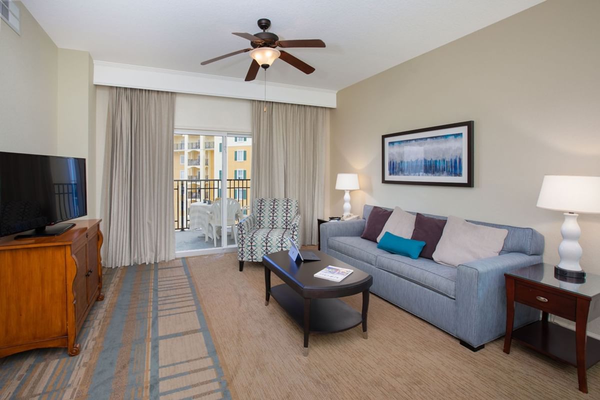 Living room area with TV in 1 Bedroom Suite at Lake Buena Vista Resort