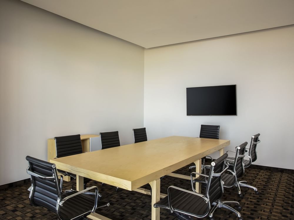 Conference table &Tv in a meeting room at Fiesta Inn Hotels