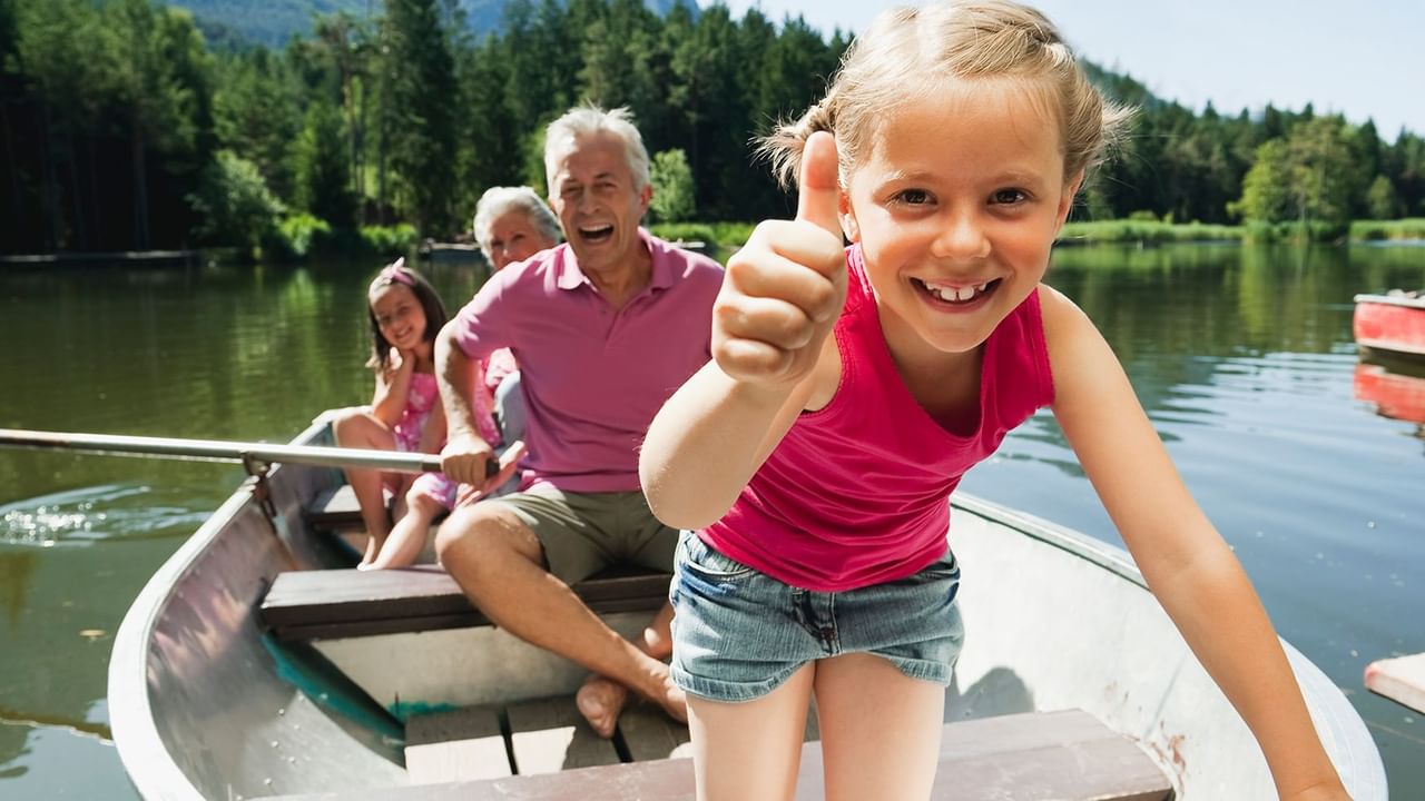 grandparents and children in a canoe