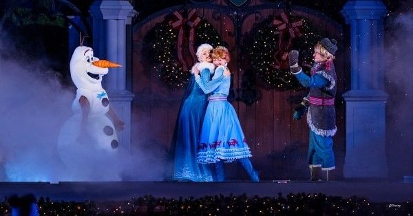 Anna, Elsa, Olaf, and Kristoff from Disney's Frozen onstage during Mickey's Very Merry Christmas Party.