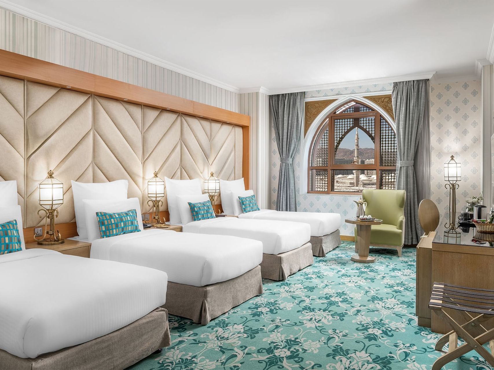 Twin beds in standard Quadruple room at Elaf Al Taqwa