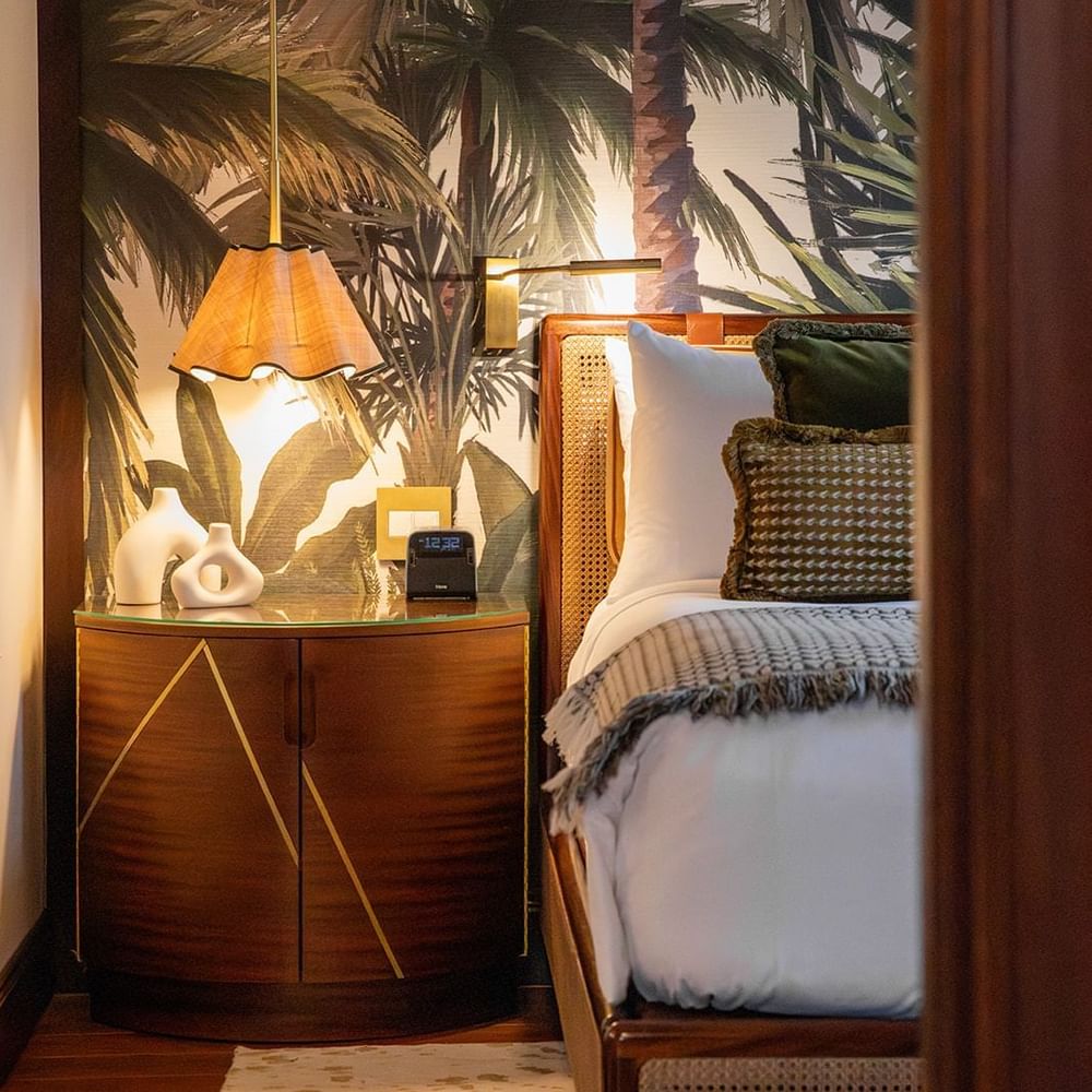 A couple having breakfast on bed at Brazilian Court