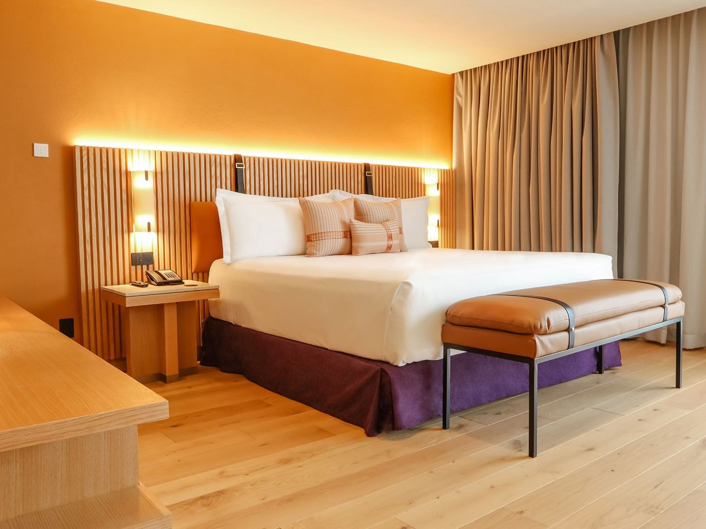 King Superior Junior Suite with a large bed and warm decor at Camino Real Polanco Mexico in Ciudad de Mexico.