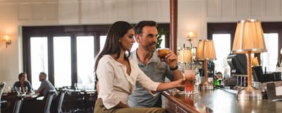 Couple sipping on drinks by the Bar counter at Catalina Island Company