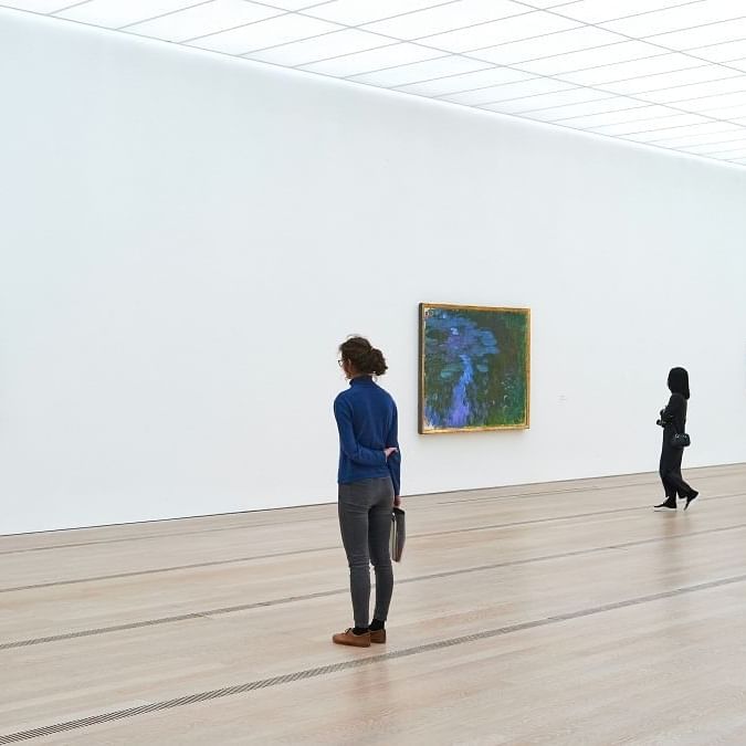 2 girls looking at artworks at Art Basel near South Beach Hotel