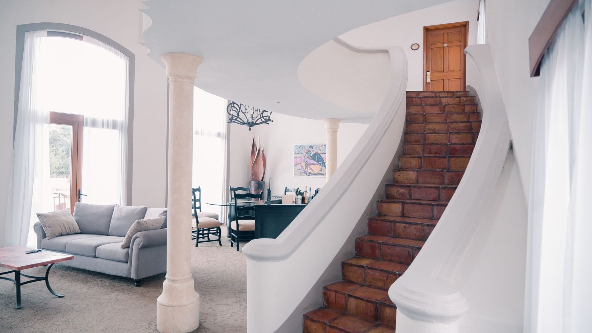 King Presidential Suite staircase with curved railings leading to upper floor at Quinta Real Zacatecas