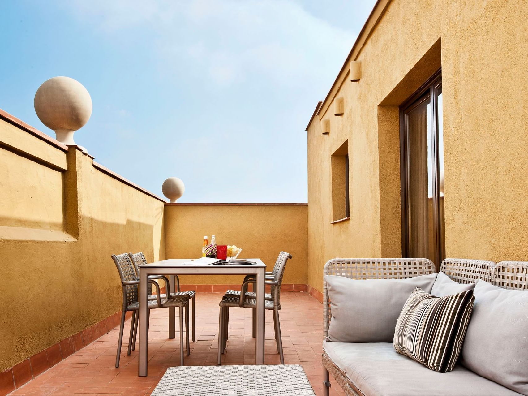 Balcony with lounges in Terrace deluxe at Barcelona Apartments