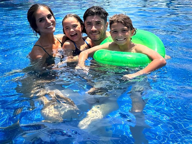 Family enjoying in the outdoor pool at Grand Fiesta Americana