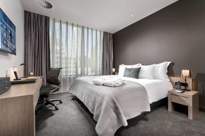 Work desk by the king bed in Contemporary Room at Melbourne Hotel Perth