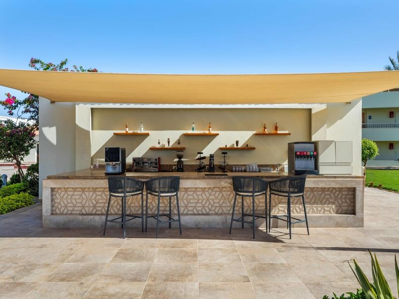 Outdoor seating with a shaded canopy at the Jacuzzi Pool Bar in Hurghada at Pickalbatros Dana Beach Resort.