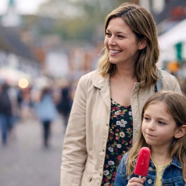 Mum and daughter exploring Godalming Spring Festival in Surrey