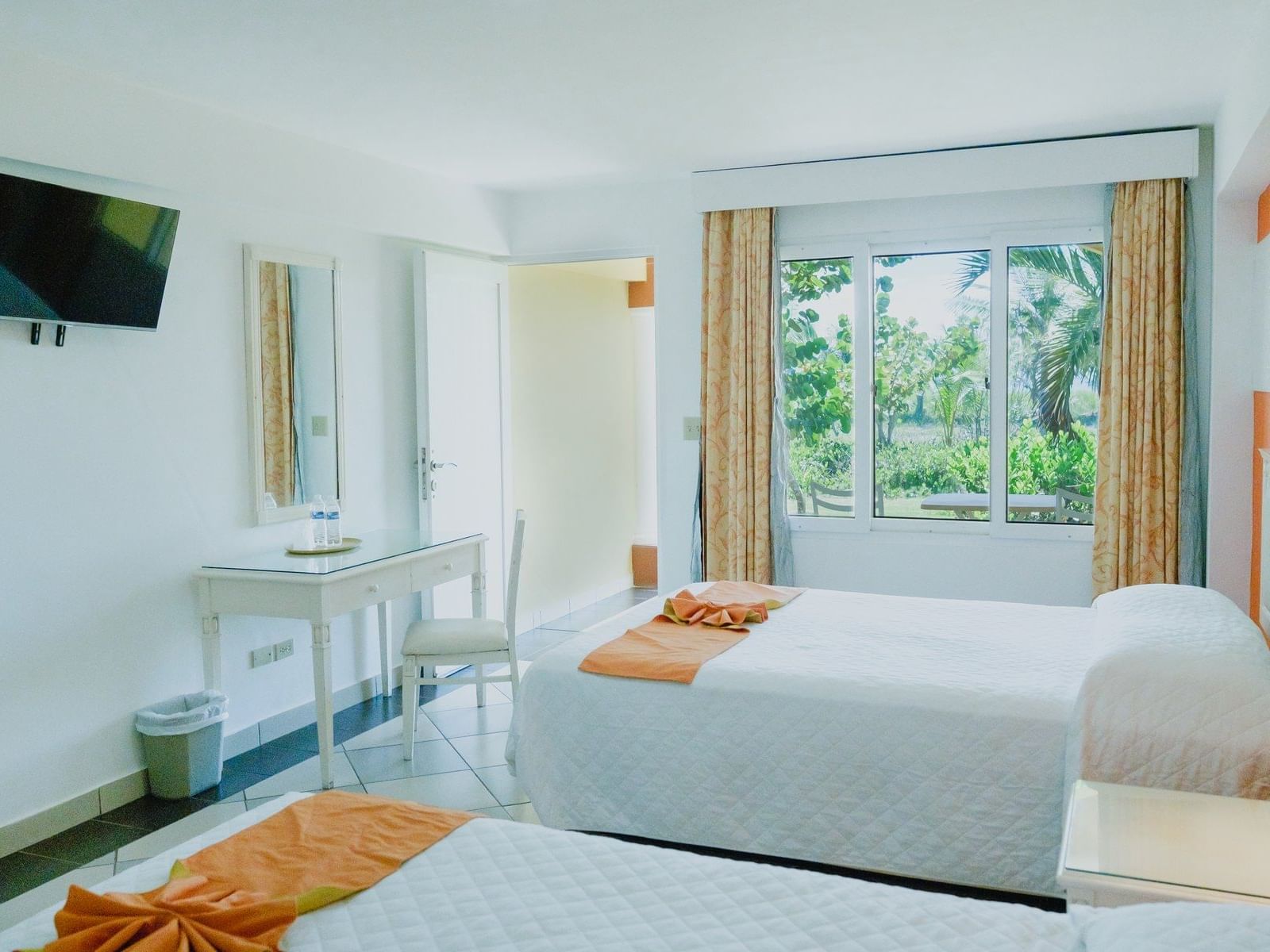 TV & work desk facing the beds in Oceanfront Two Queen Beds with Terrace at Las Olas Beach Resort