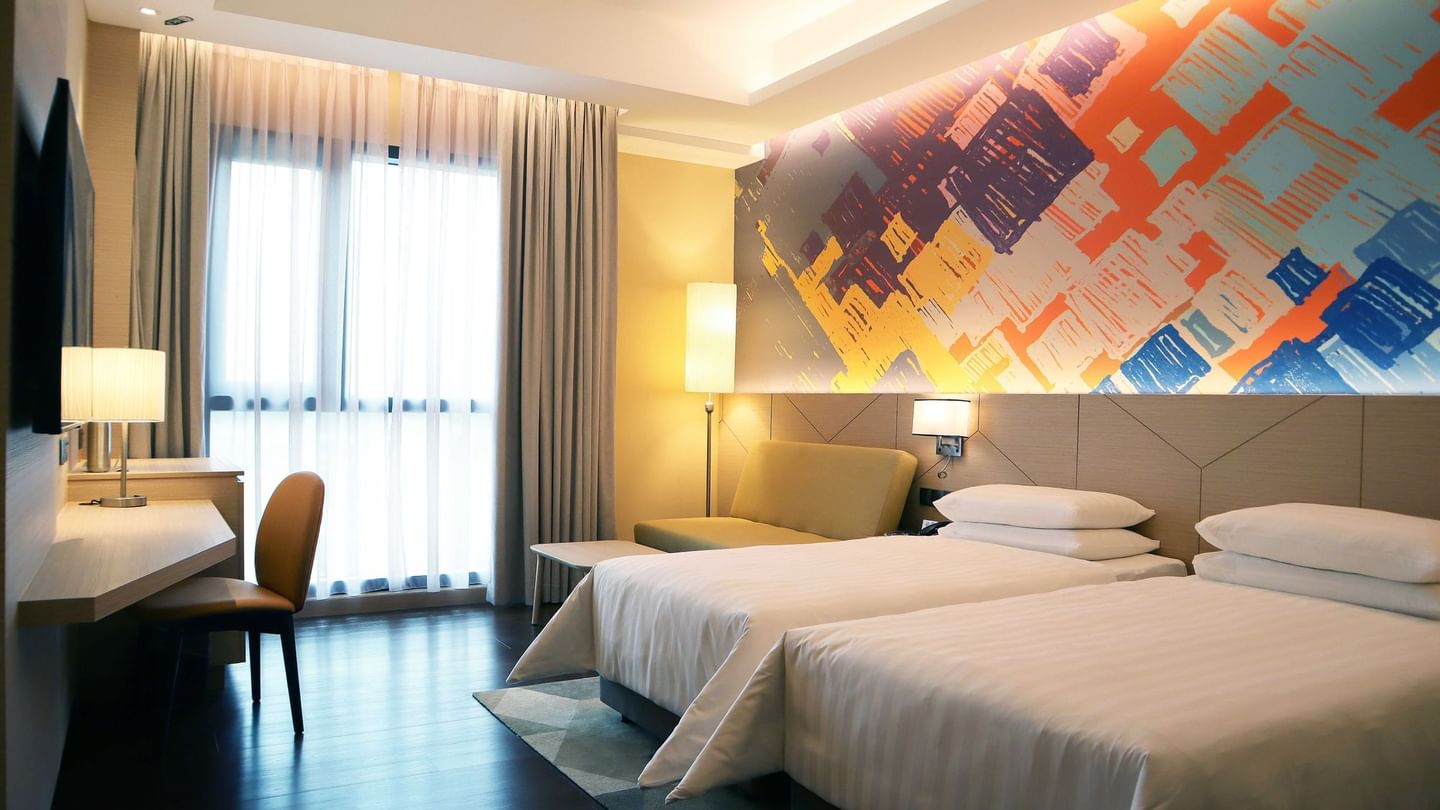 King-size bed and TV in Deluxe Classic King at Sunway Putra Hotel