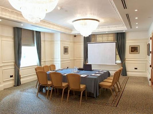 Brown chairs arranged in Blue Room at Orsett Hall Hotel