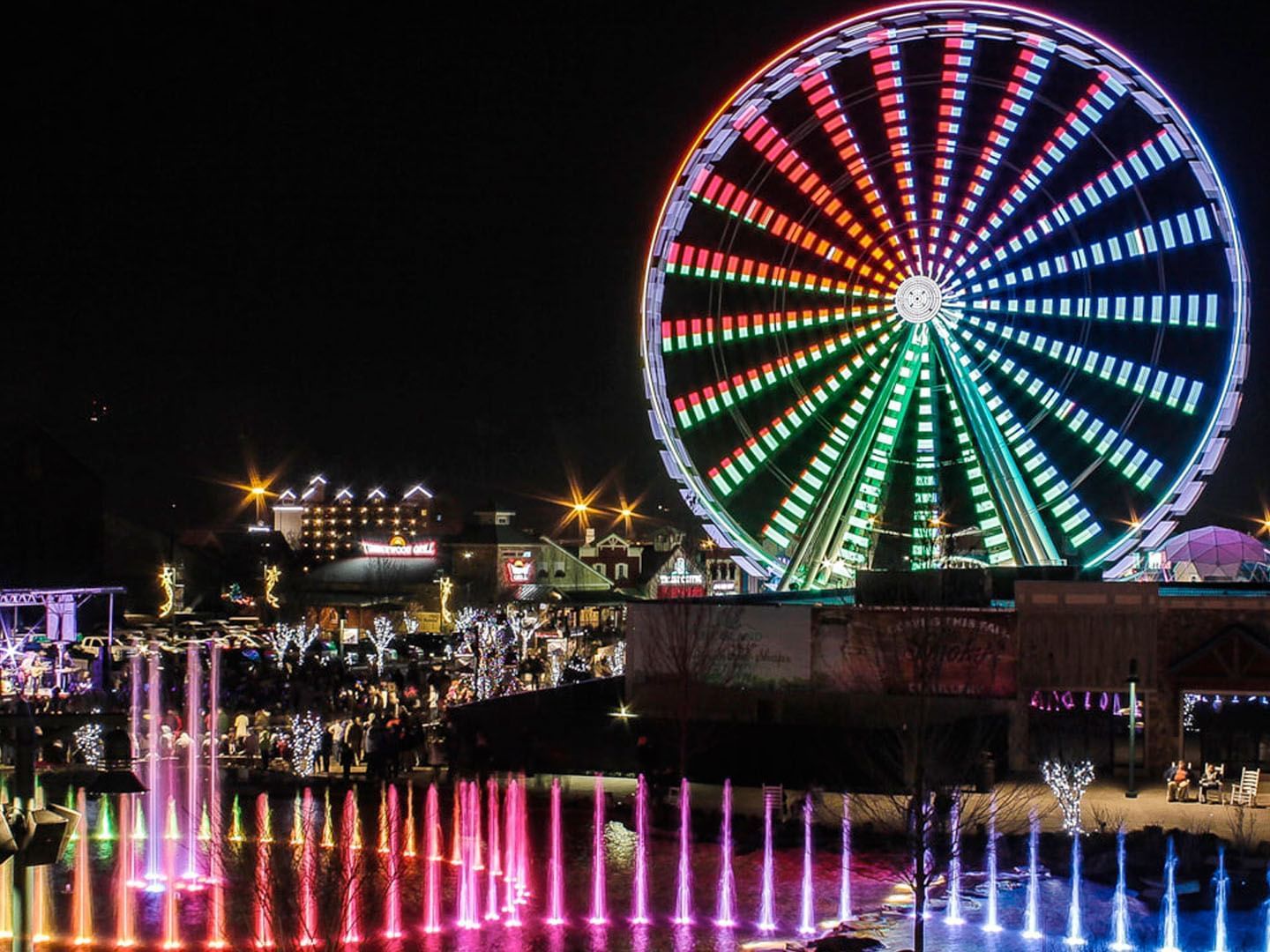 View of a fountain & Ferris wheel near Music Road Resort