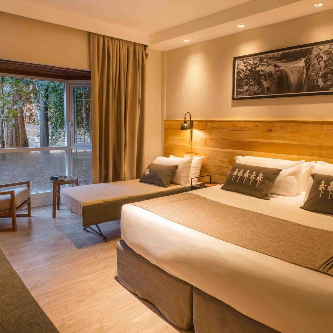Luxury room with king bed & sofa at La Cascada Casa Patagonica