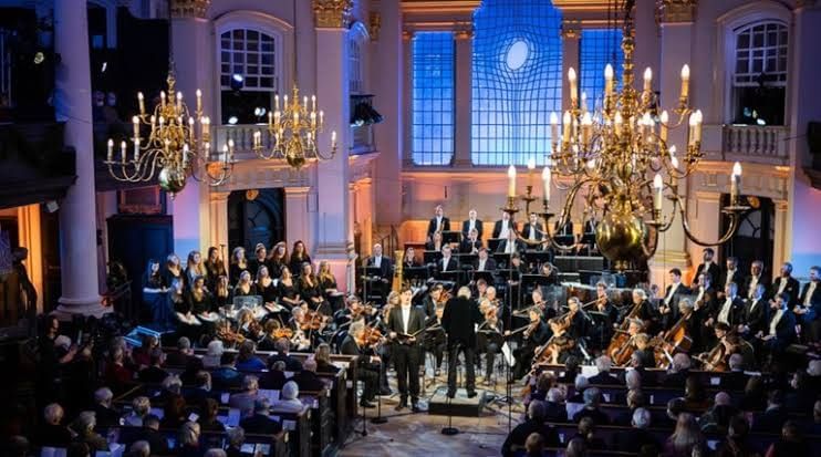 Orchestra performing in an elegant candlelit venue at St Martin, Trafalgar Square
