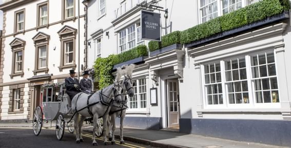 Horses going with Carriage in front of Villiers Hotel