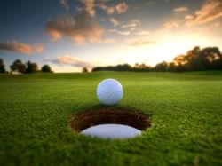 Closeup of a golf ball near the cup at ICONA Windrift