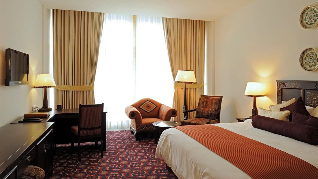 Executive Room with 1 King Bed, couch at Dushanbe Serena Hotel