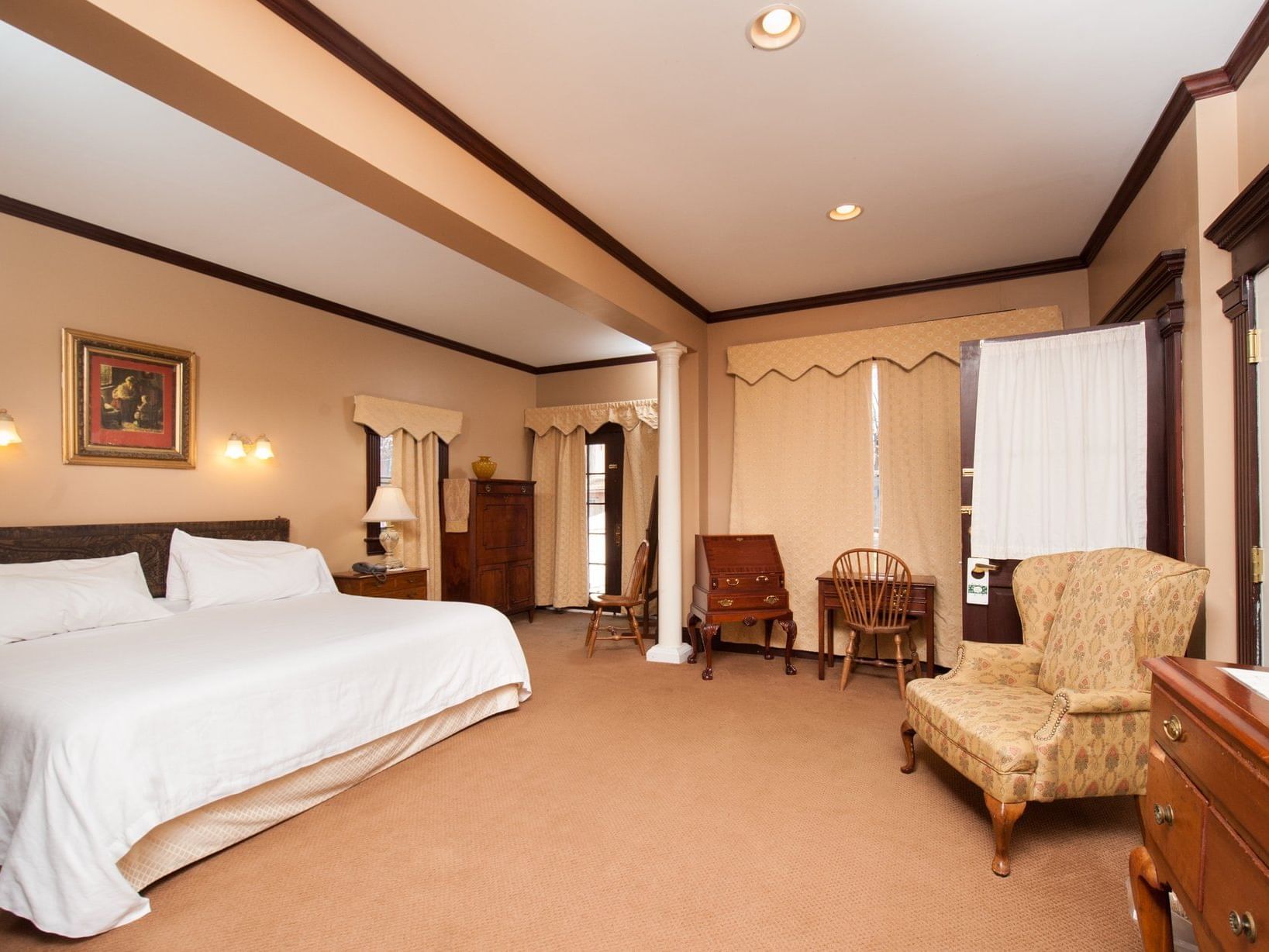 Bed & furniture in Brownell Cottage Suite A at The Inn Saratoga