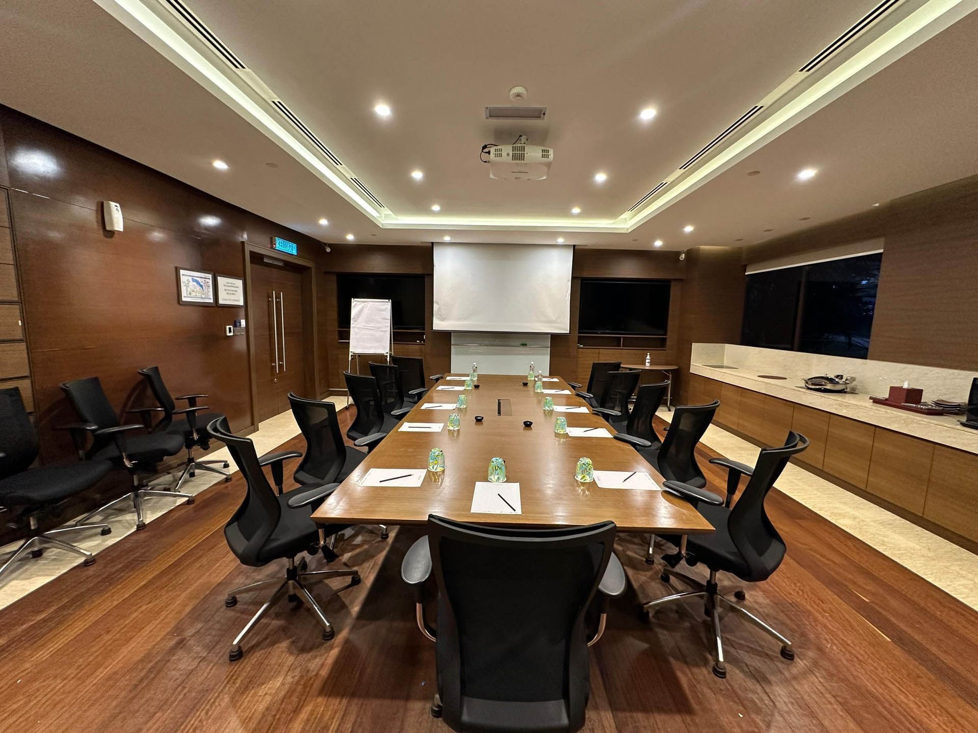 Conference table set-up in Turquoise meeting room with wooden floors & refreshments corner at Saujana Hotel Kuala Lumpur