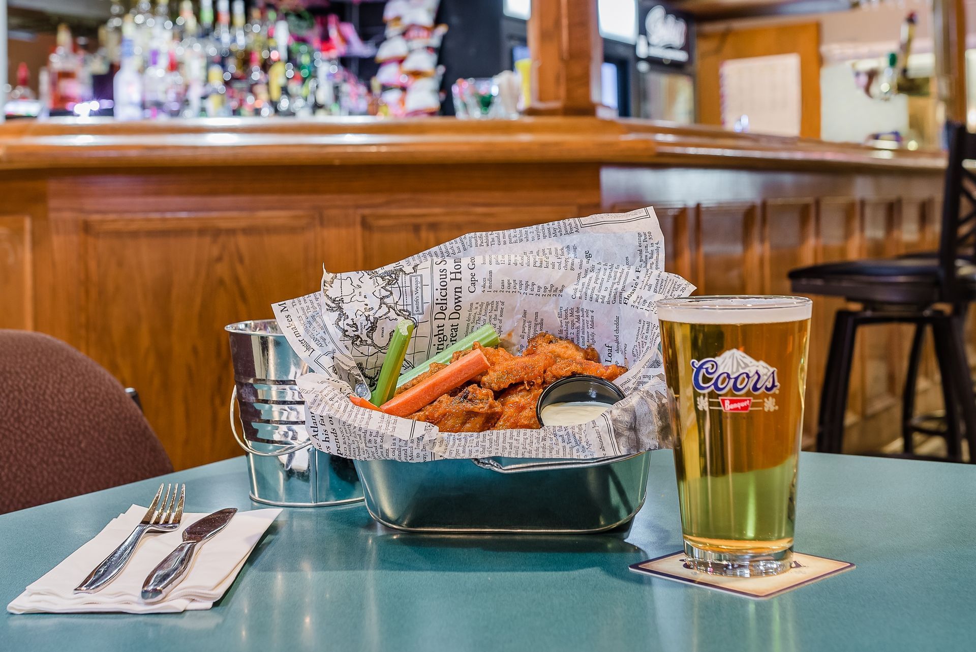 Buffalo chicken wings and draft beer