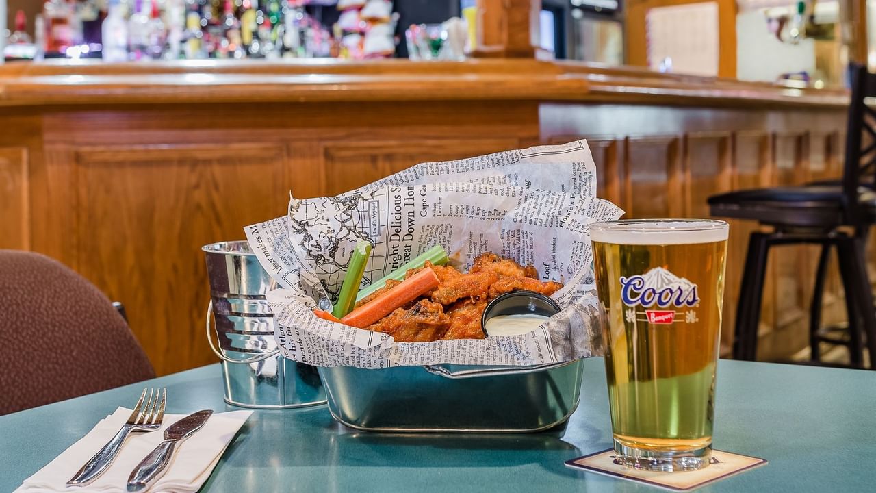 Buffalo chicken wings and draft beer