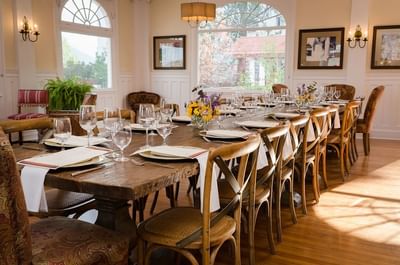 A beautifully set long rustic dining table at The Stanley Hotel for a private event or intimate gathering