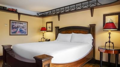 white bed and train decorations