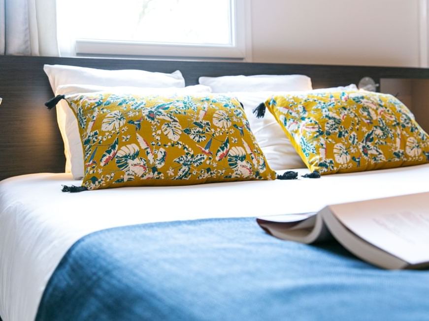 Kings bed in superior room at The Originals Hotels  